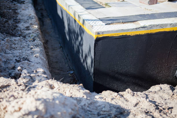 Professional Waterproofing technician working in Bloomdale, OH